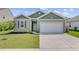 Charming home with manicured lawn, attached garage and delightful curb appeal at 212 Rubles Ln, Moncks Corner, SC 29461