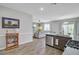 Open floor plan showcasing kitchen island with granite countertops and stainless steel appliances to the adjacent living room at 212 Rubles Ln, Moncks Corner, SC 29461