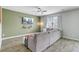Cozy living room featuring a large sectional sofa, ceiling fan, and a mounted television on an accent wall at 212 Rubles Ln, Moncks Corner, SC 29461