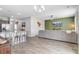 Open-concept space with a living room featuring a mounted TV and kitchen with barstool seating on the kitchen island at 212 Rubles Ln, Moncks Corner, SC 29461
