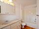 Bright bathroom featuring a classic vanity, toilet, and a bathtub with a shower at 2300 Bethera Rd # A, Bonneau, SC 29431
