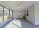 Relaxing screened porch with a ceiling fan and a door that leads to the outside, perfect for all seasons at 2300 Bethera Rd # A, Bonneau, SC 29431