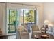 Cozy seating arrangement near a large sliding glass door that offers a scenic view from the balcony at 2372 Darts Cove Way, Mount Pleasant, SC 29466