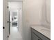 Bright bathroom with white tile and modern fixtures, as seen through a doorway at 2372 Darts Cove Way, Mount Pleasant, SC 29466