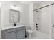 Well-lit bathroom with gray vanity and tub and shower combination with black fixtures at 2372 Darts Cove Way, Mount Pleasant, SC 29466