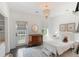 Cozy bedroom with a chandelier, plush carpet, and natural light at 2372 Darts Cove Way, Mount Pleasant, SC 29466