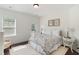 Cozy bedroom featuring natural light, neutral decor, and a relaxing ambiance at 2372 Darts Cove Way, Mount Pleasant, SC 29466