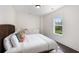 Cozy bedroom with a woven headboard, crisp white linens, and plenty of natural light at 2372 Darts Cove Way, Mount Pleasant, SC 29466