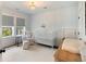 Well-decorated Bedroom with crib, chair, and natural light at 2372 Darts Cove Way, Mount Pleasant, SC 29466