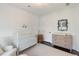 Bright Bedroom featuring a white crib, changing table, and neutral decor at 2372 Darts Cove Way, Mount Pleasant, SC 29466