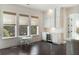 Charming breakfast nook adjacent to the kitchen with a wine cooler and views from the three windows at 2372 Darts Cove Way, Mount Pleasant, SC 29466