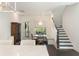 Bright breakfast nook with a chandelier, built-in bench seating, and a staircase to the upper level at 2372 Darts Cove Way, Mount Pleasant, SC 29466