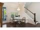 Cozy breakfast nook featuring a round table, bench seating, chandelier, and access to the outdoors at 2372 Darts Cove Way, Mount Pleasant, SC 29466