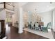 Elegant dining room featuring stylish chairs, a chandelier, and hardwood floors for refined dining at 2372 Darts Cove Way, Mount Pleasant, SC 29466