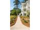 Charming exterior featuring a landscaped front yard and covered front porch at 2372 Darts Cove Way, Mount Pleasant, SC 29466