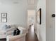 Bright hallway area featuring hardwood floors, comfortable seating, and transom windows at 2372 Darts Cove Way, Mount Pleasant, SC 29466