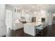 Bright, open kitchen with a large island, pendant lighting, and white cabinetry for a modern feel at 2372 Darts Cove Way, Mount Pleasant, SC 29466