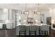 Spacious kitchen with a large island, barstool seating, stainless steel appliances, and ample counter space at 2372 Darts Cove Way, Mount Pleasant, SC 29466