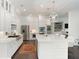 Well-equipped kitchen featuring stainless steel appliances, a large island, and elegant pendant lighting fixtures at 2372 Darts Cove Way, Mount Pleasant, SC 29466