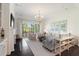 Bright living room with comfortable seating, large windows, and stylish decor, perfect for relaxation at 2372 Darts Cove Way, Mount Pleasant, SC 29466