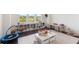 Inviting playroom features large windows, built-in shelving, and plenty of space for toys and activities at 2372 Darts Cove Way, Mount Pleasant, SC 29466