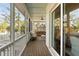 Covered porch with furniture set, exterior fan, and sliding glass doors at 2372 Darts Cove Way, Mount Pleasant, SC 29466