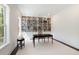 Bright study with built-in bookshelves, a classic desk, and a window offering natural light at 2372 Darts Cove Way, Mount Pleasant, SC 29466