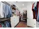 Spacious walk-in closet with custom shelving, drawers, and ample storage space, perfect for organization and convenience at 2372 Darts Cove Way, Mount Pleasant, SC 29466