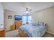 Cozy bedroom with ceiling fan, blue bedding, and television for relaxing after a long day at 2427 Stingray Blvd, North Charleston, SC 29406