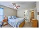 Comfortable bedroom with ceiling fan, neutral walls, and en suite bathroom for added privacy at 2427 Stingray Blvd, North Charleston, SC 29406