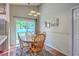 Cozy dining area with hardwood floors and a sliding glass door to the backyard at 2427 Stingray Blvd, North Charleston, SC 29406