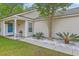 Charming home with manicured lawn, stone landscaping, and a cozy front porch at 2427 Stingray Blvd, North Charleston, SC 29406