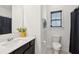 Bathroom features sink vanity, a toilet, tiled floors and window for natural light at 247 Godwit Dr, Summerville, SC 29486