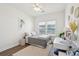 Cozy bedroom with ceiling fan, natural light and window overlooking backyard lake views at 247 Godwit Dr, Summerville, SC 29486