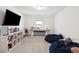 Neutral bedroom with desk, shelving, a television, and beanbag chairs at 247 Godwit Dr, Summerville, SC 29486