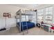 Bedroom with bunk beds, a large window for natural light, and desk with plenty of room for activities at 247 Godwit Dr, Summerville, SC 29486