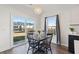 Eat-in kitchen featuring a table with four chairs and natural lighting from a sliding glass door at 247 Godwit Dr, Summerville, SC 29486