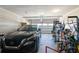 Well-organized garage featuring a black SUV and a variety of sports equipment at 247 Godwit Dr, Summerville, SC 29486
