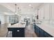 Modern kitchen boasts a large island, stainless appliances, white cabinets, and pendant lighting at 247 Godwit Dr, Summerville, SC 29486