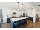 Modern kitchen with white cabinets, stainless steel appliances, and large island at 247 Godwit Dr, Summerville, SC 29486