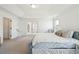 Bright main bedroom with tray ceilings, french doors, soft carpet and walk-in closet access at 247 Godwit Dr, Summerville, SC 29486