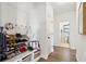 Mud room offers storage and seating with decor, hardwood floors and access to hallway and bathroom at 247 Godwit Dr, Summerville, SC 29486