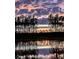 Beautiful lake at sunset with reflections of trees and clouds on the water at 247 Godwit Dr, Summerville, SC 29486