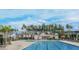 A luxurious community pool with ample seating, perfect for relaxing and enjoying sunny days with beautiful architectural style buildings at 247 Godwit Dr, Summerville, SC 29486