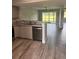 Beautiful kitchen with granite countertops, stainless appliances, and attractive wood-look flooring at 2602 Hidden Gove Dr # 2602, Moncks Corner, SC 29461