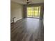 Bright, airy living room with ceiling fan and access to the screened in porch, perfect for relaxation at 2602 Hidden Gove Dr # 2602, Moncks Corner, SC 29461