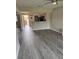 Open living area leads to a kitchen and laundry space at 2602 Hidden Gove Dr # 2602, Moncks Corner, SC 29461
