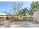 Wooden deck overlooking trees and water with railing offers serene outdoor living and relaxation at 27 Brockman Dr # 27-C, Charleston, SC 29412