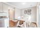 Bright dining area featuring modern decor, hardwood floors, and a stainless steel dishwasher at 27 Brockman Dr # 27-C, Charleston, SC 29412