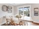 Dining area with wooden table and access to outdoor patio through sliding glass doors at 27 Brockman Dr # 27-C, Charleston, SC 29412